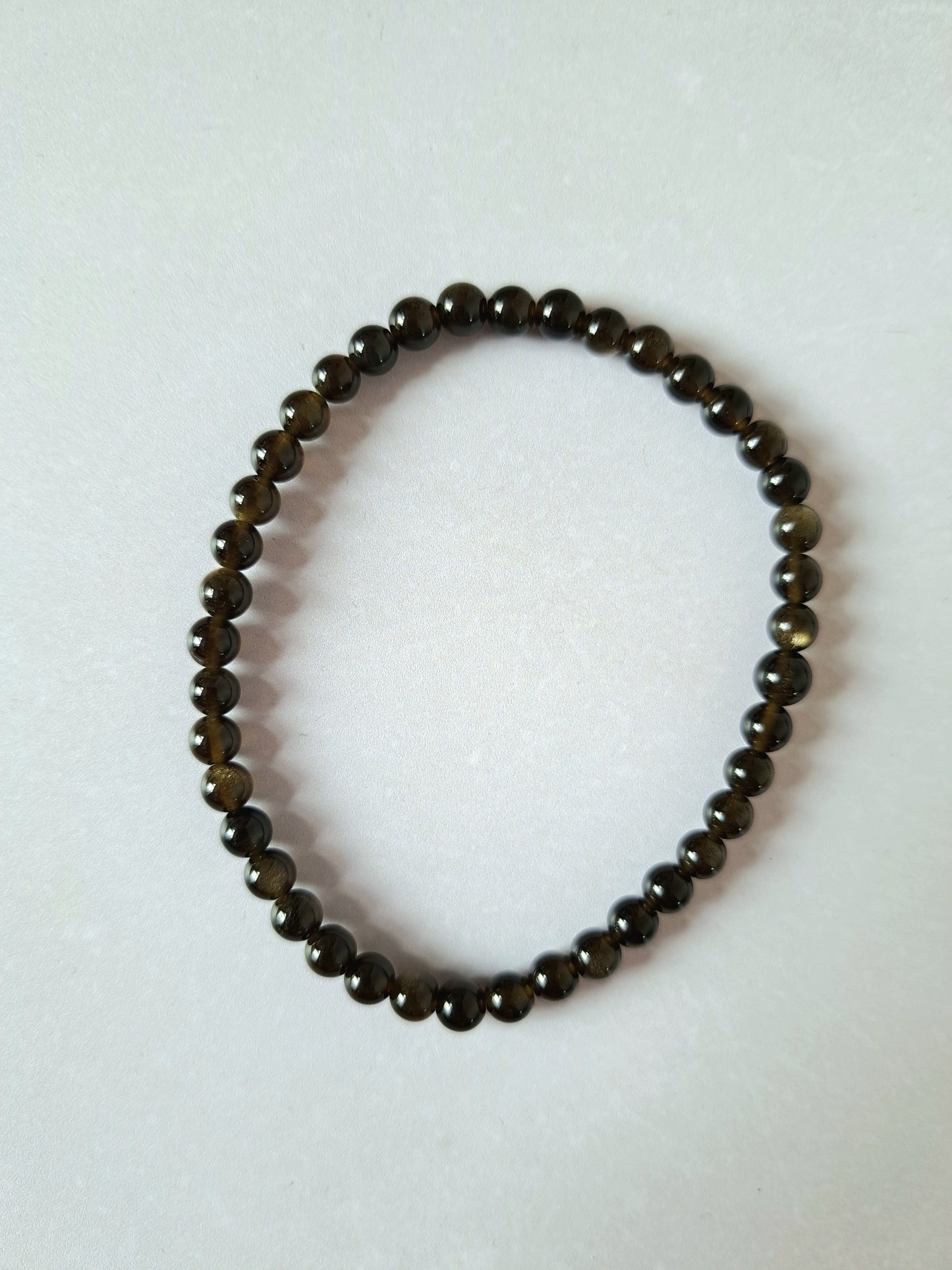Kralenarmband obsidiaan goud 4mm